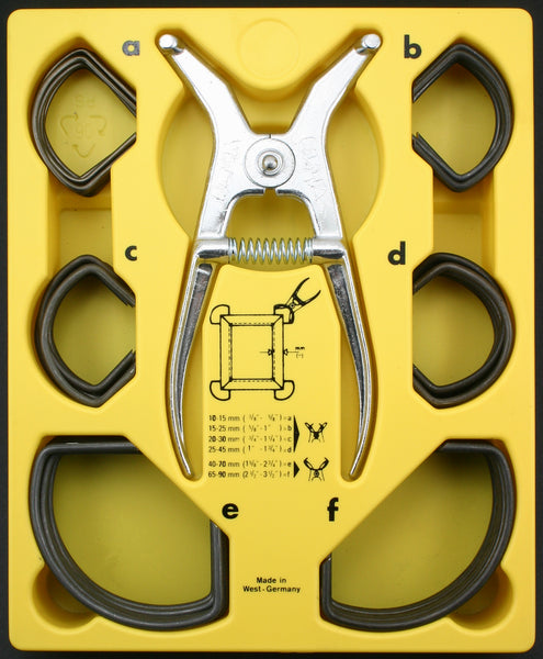 Full set of spring clamps for miter joints. Top down view of 6 sizes and pliers